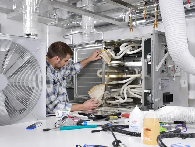 Scituate Air Duct Cleaning specialist performing precision AC coil cleaning in Scituate