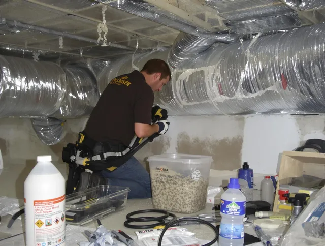 Scituate Air Duct Cleaning specialist performing professional mold removal from air ducts in Scituate
