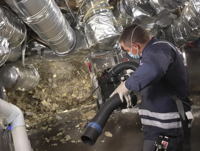 Scituate Air Duct Cleaning specialist operating negative pressure cleaning equipment for thorough duct maintenance in Scituate