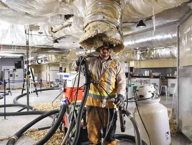 Professional vacuum insulation removal by Scituate Air Duct Cleaning expert in Scituate